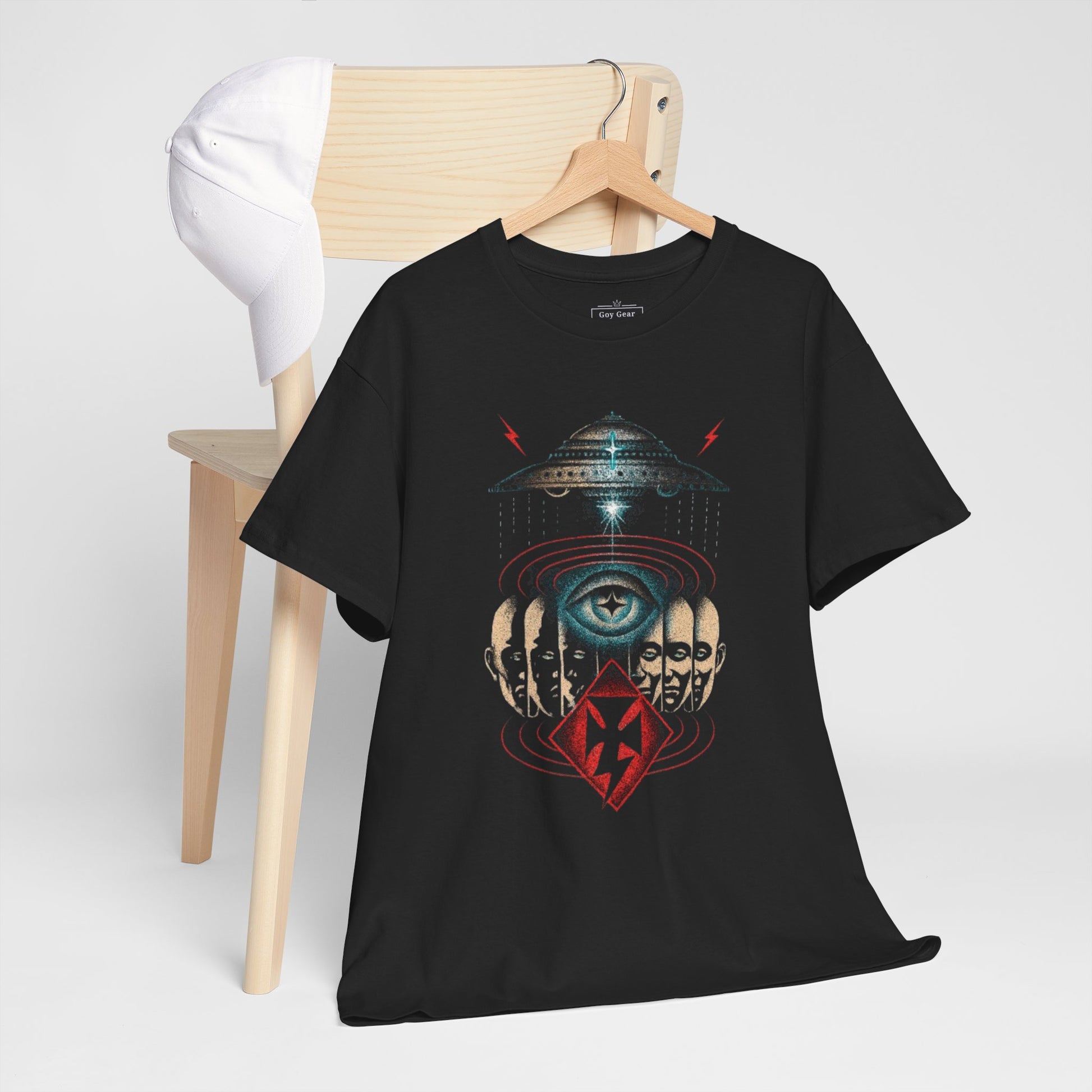Black t-shirt with alien design on a wooden chair against a white background